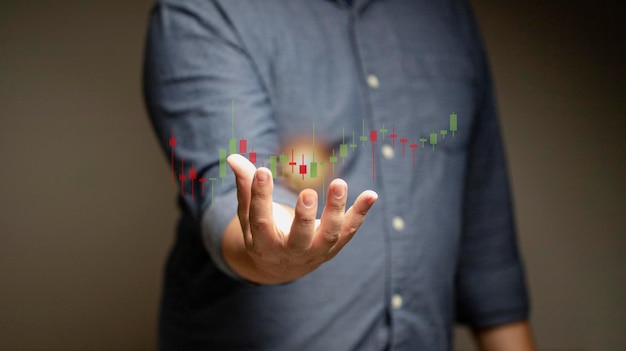 Business man stock market forecast trend year charts and candlesticks stock market movement trend