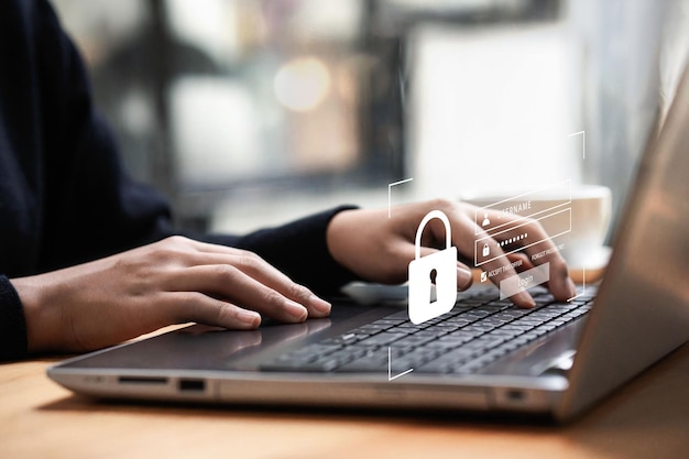 Business man typing on computer keyboard cybersecurity and privacy concept to protect data Entering the username and password for the lock icon and Internet network security technology