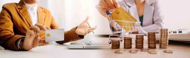 Business man using credit card and calculator for shopping online selective focus