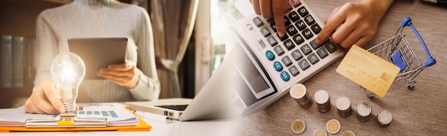 Business man using credit card and calculator for shopping online selective focus