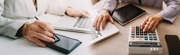 Business man using credit card and calculator for shopping online selective focus