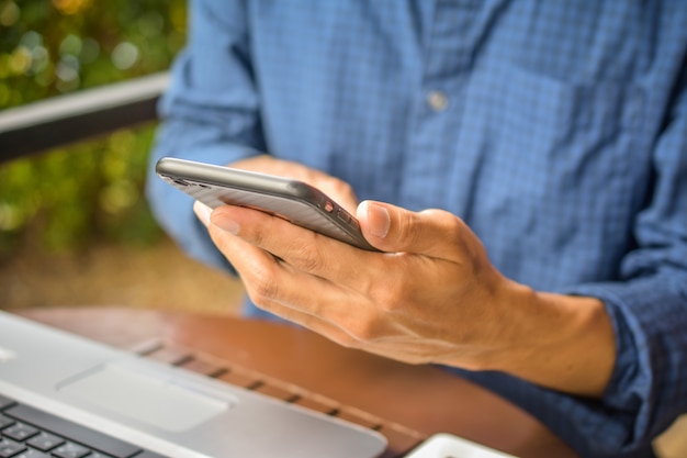 Business man using mobile smart phone