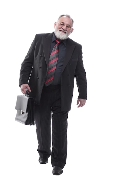 Business man with a briefcase walking forward isolated on a white