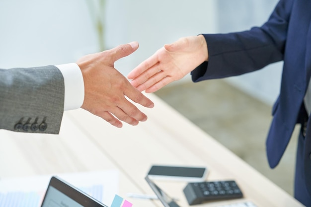 Business man and woman shaking hands