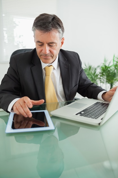 Business man working on digital tablet