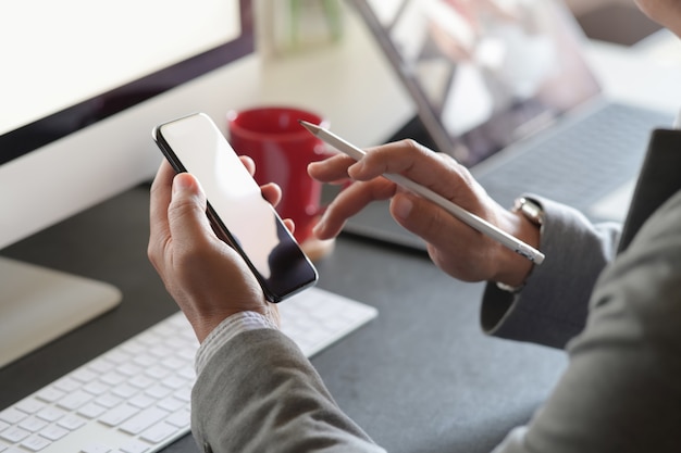 Business man working with mobile phone in office