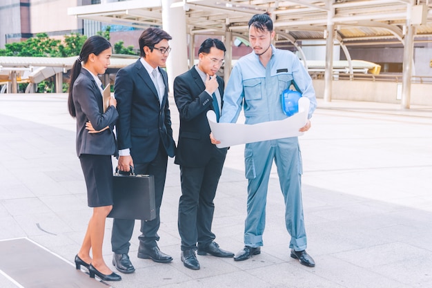 Business manager and engineer meeting project at construction site