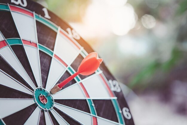 Business marketing success concept Red dart arrow in center of the target dartboard Bullseye is a target of business