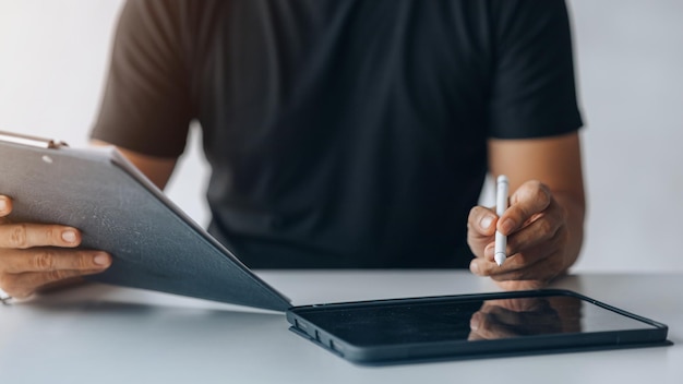 Business men are looking at the company's financial documents on tablets to analyze problems and find solutions before bringing the information to a meeting with a partner Financial concept