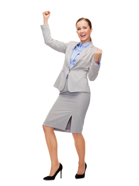 business and office concept - young happy businesswoman with hands up