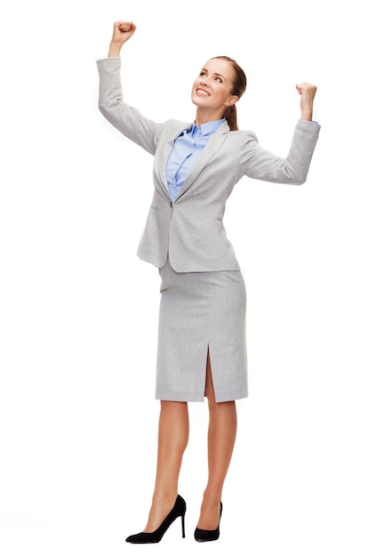 business and office concept - young happy businesswoman with hands up