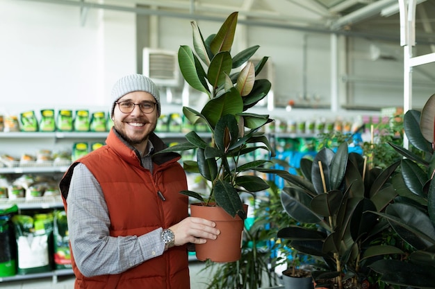 Business owner of flower and potted plant shops looking at the camera with a smile