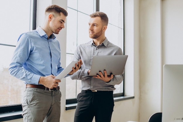 Business partners discussing paper work in office