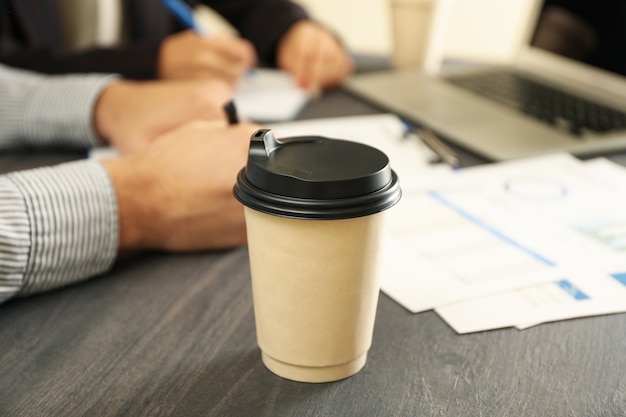 Business partners doing a financial planning on black wooden table