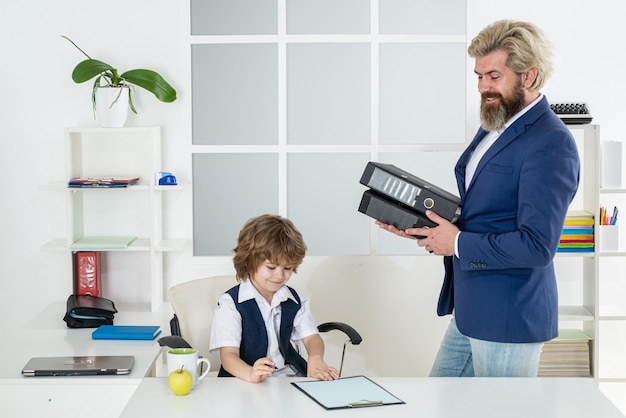 Business partners little child businessman and his older mentor marketing team meeting brainstorming...