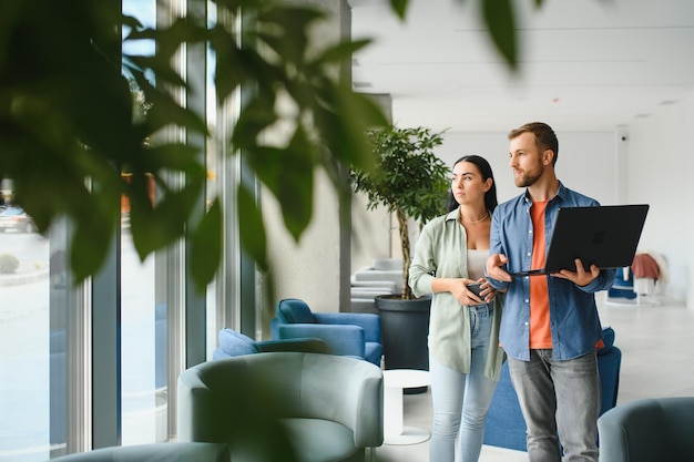 Business partners meeting in office lobby