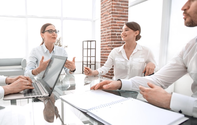 Business partners sitting at the Deskmeetings and partnerships