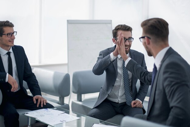 Business partners talking at the office Desk in the business center