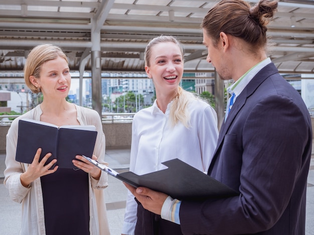 Business people are talking outside the office,outdoor meeting