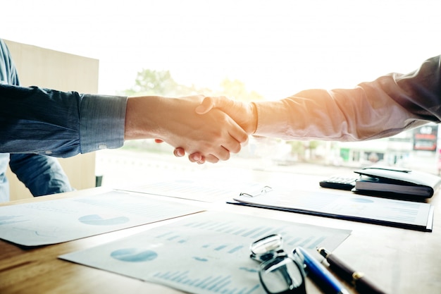 Business people colleagues shaking hands meting Planning Strategy Analysis