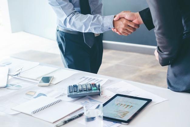 Business people colleagues shaking hands 