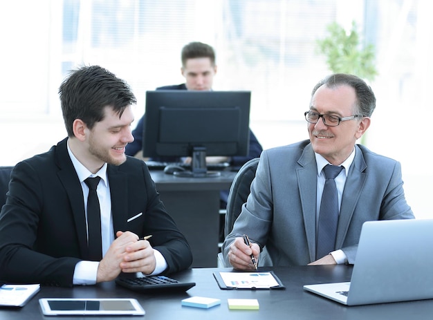 Business people discussing document stock at the office