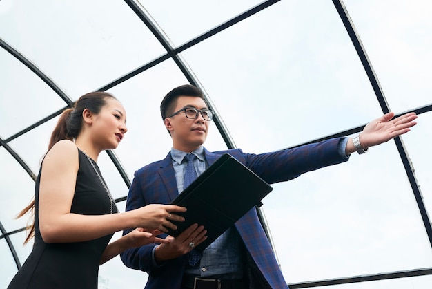 Business people examining new office building