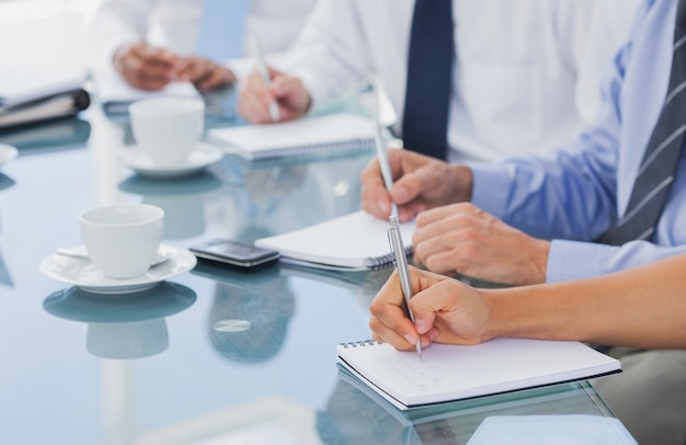 Business people hands taking some notes