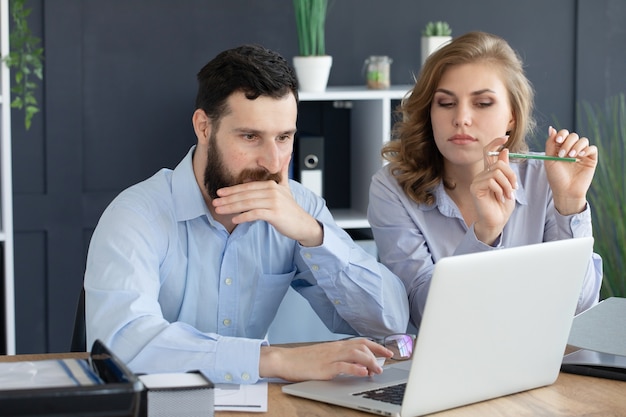 Business people Having Meeting Around Table In Modern Office