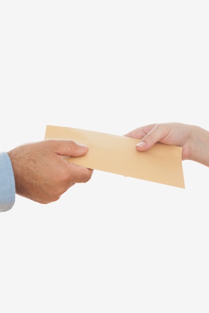 Business people holding envelope