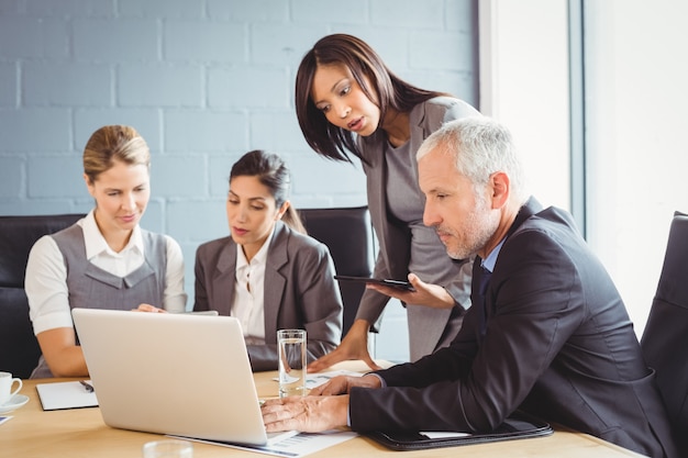 business people interacting in conference room