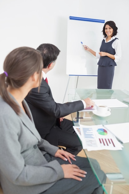 Business people listening to their manager carefully