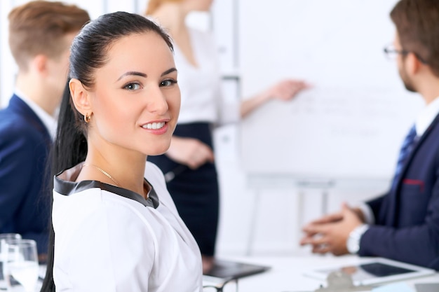 Business people at a meeting in the office. Focus on boss woman.