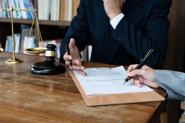 Business people negotiating a contract Human hands working with documents at desk and signing contract