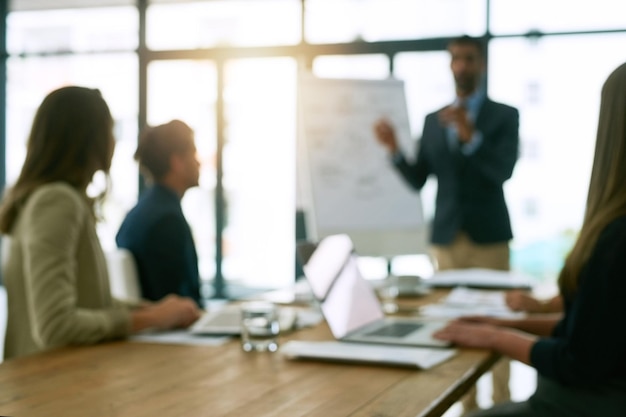 Business people and presentation in office on meeting for planning and conversation as partner Employee teamwork and collaboration with discussion on report for feedback on company growth