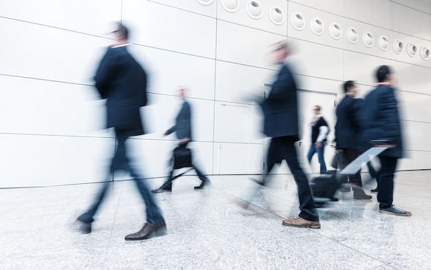 business people rushing in a corridor at a business center. ideal for websites and magazines layouts