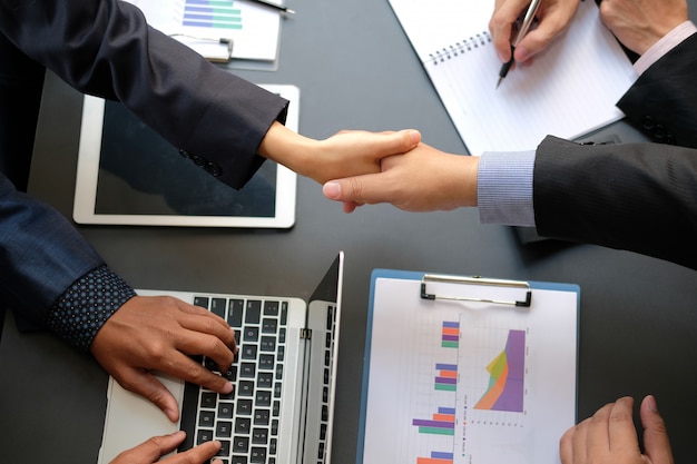 Business people shaking hands after meeting. 