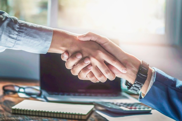 Business people shaking hands, finishing up a meeting