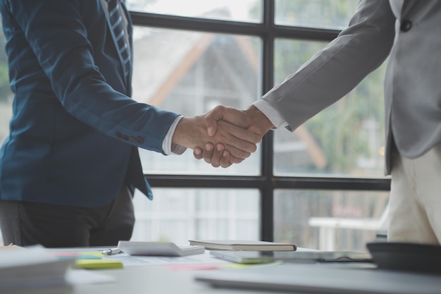 Business people shaking hands finishing up a meeting