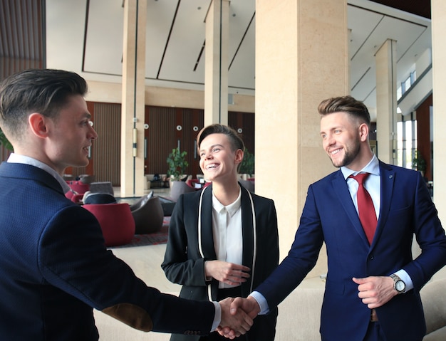 Business people shaking hands, finishing up a meeting