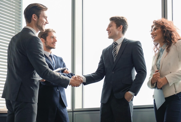 Business people shaking hands finishing up a meeting