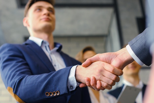 Business people shaking hands finishing up a meeting