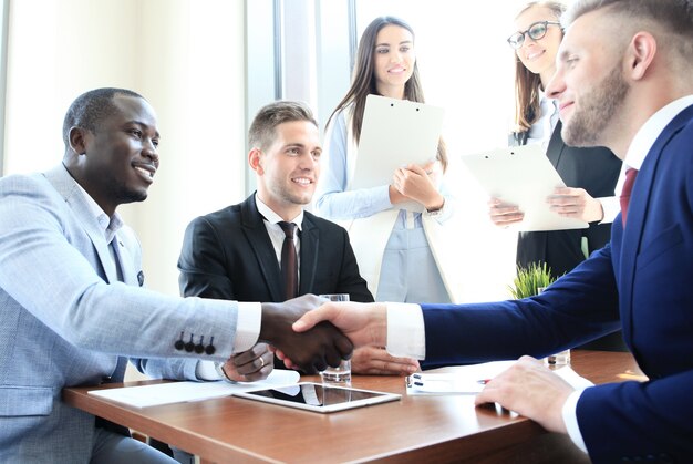 Business people shaking hands, finishing up a meeting