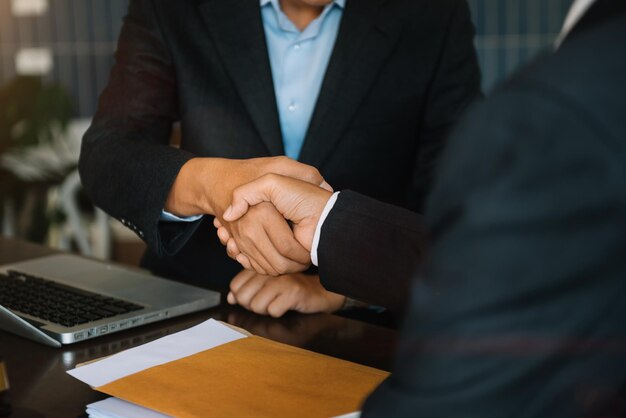 Business people shaking hands, finishing up a meeting.