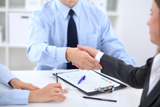 Business people shaking hands finishing up a meeting