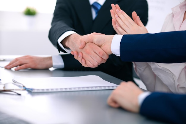 Business people shaking hands finishing up a meeting