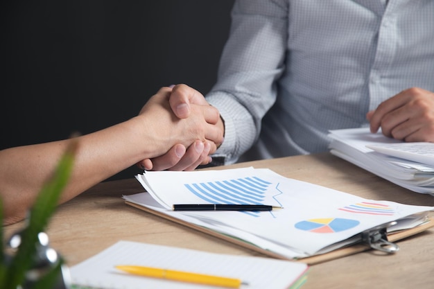 Business people shaking hands in office