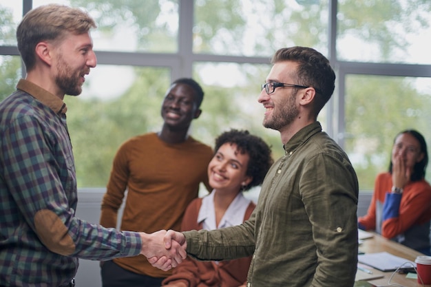 Business people shaking hands in office