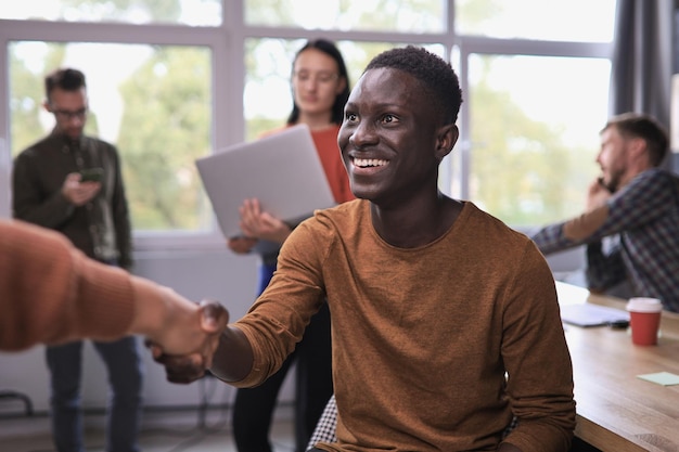 Business people shaking hands in office