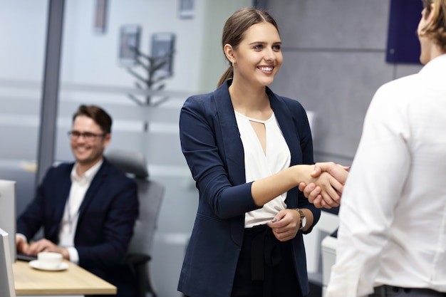 business people shaking hands in the office